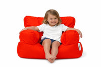 girl sitting on a bright red kids bean bag chair