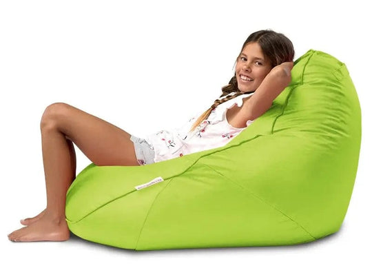Person sitting on a green bean bag chair against a white background